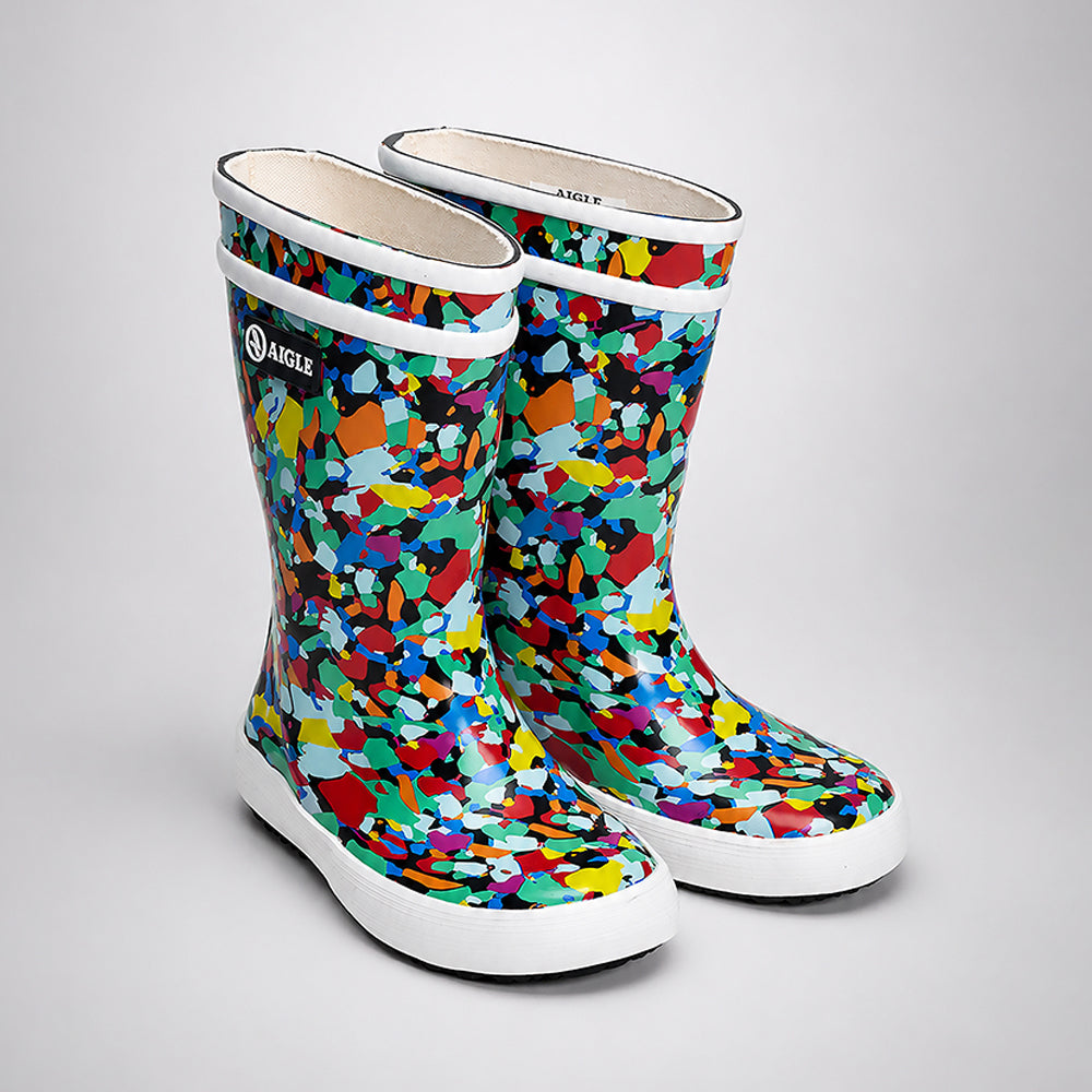 Colorful patterned rain boots on a light gray background