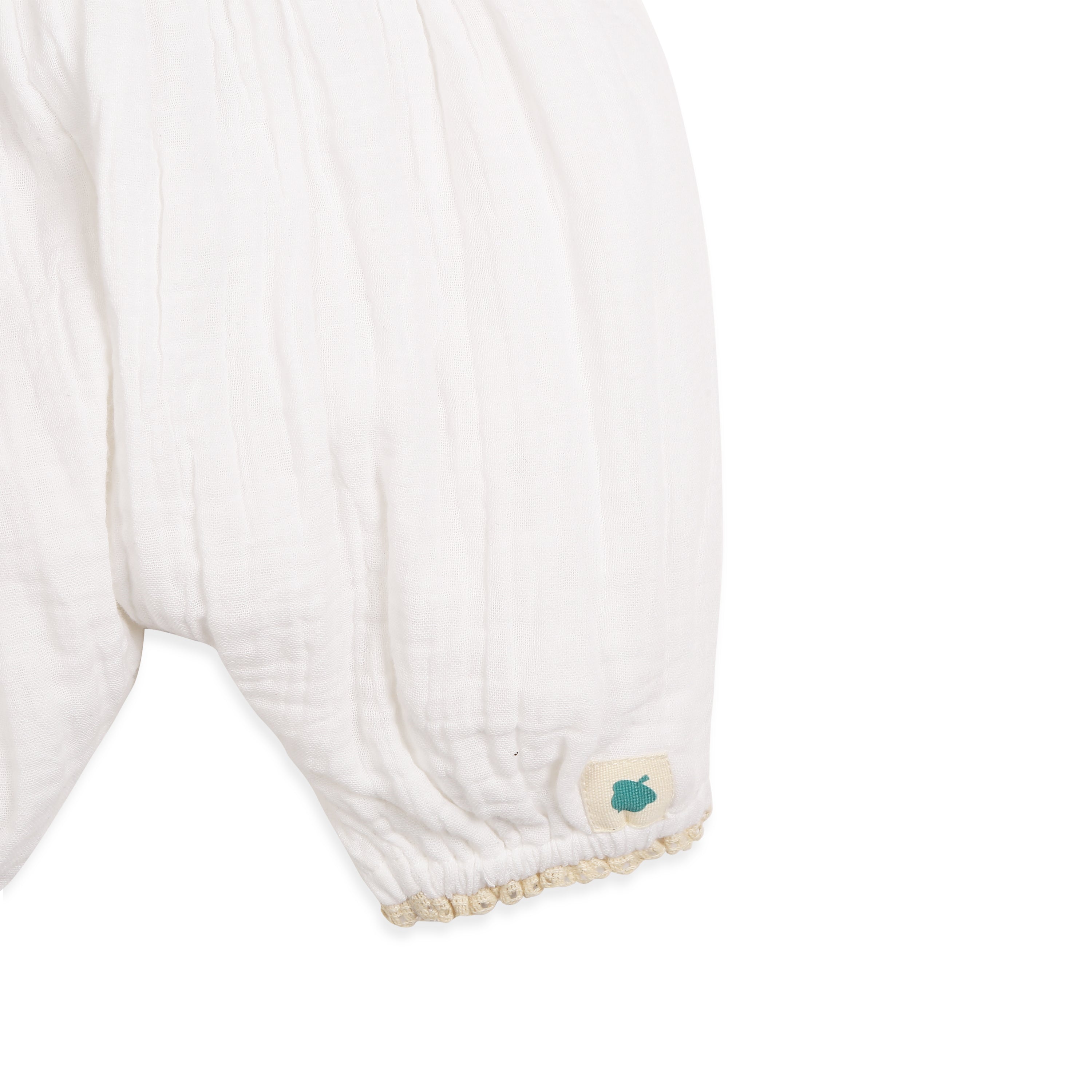 My Milestones Fawn Crochet Yoke Romper in Double Cloth with Ruffle Details - White