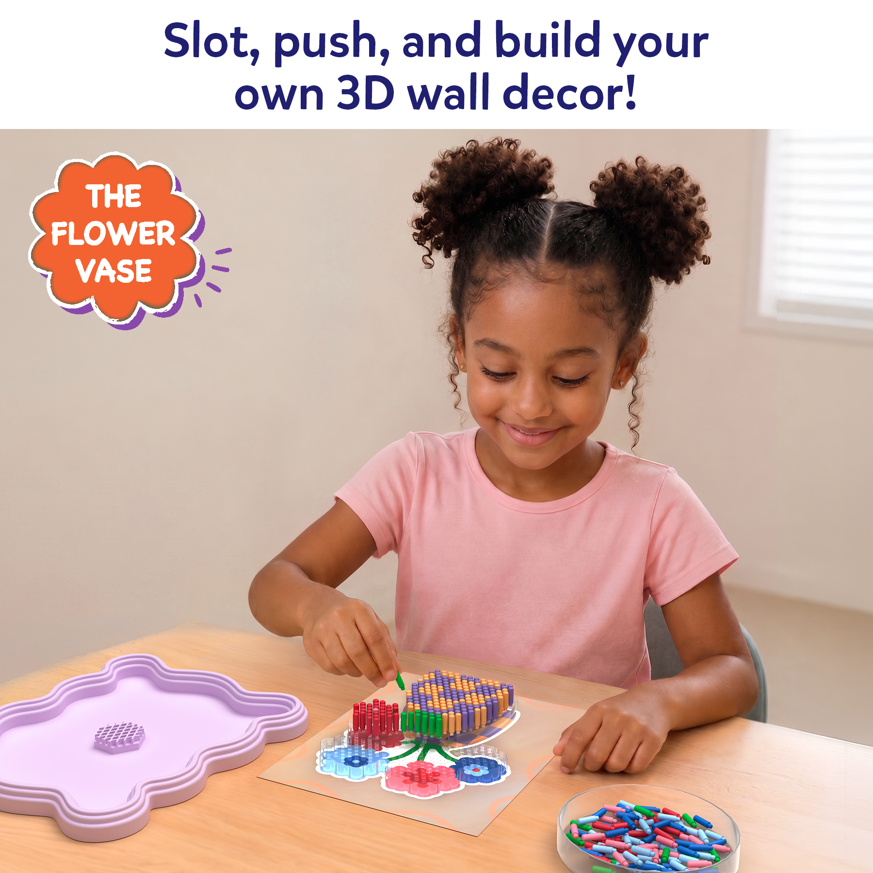 Child building a 3D wall decor with colorful pieces on a table.