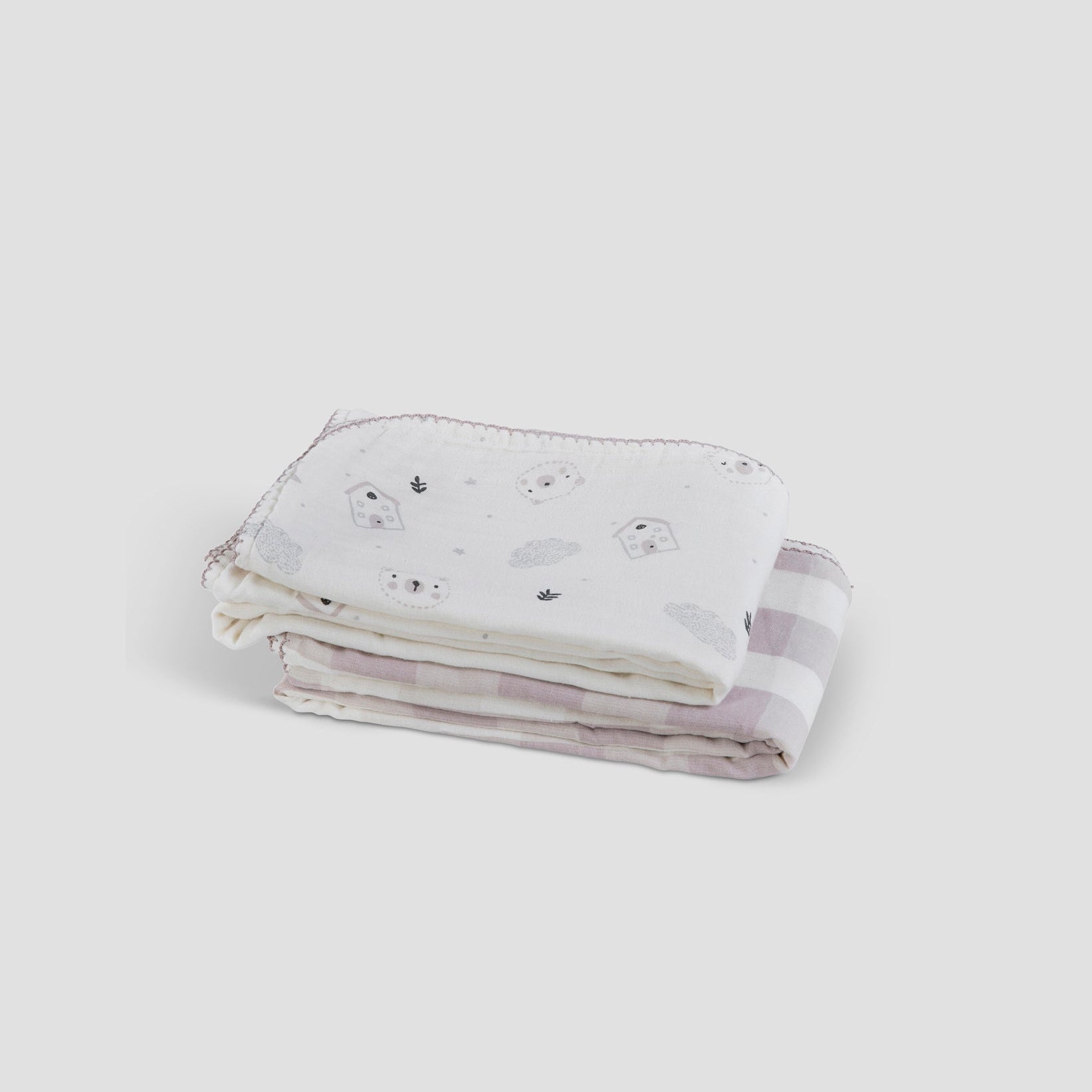 Folded fabric with a subtle pattern on a white background