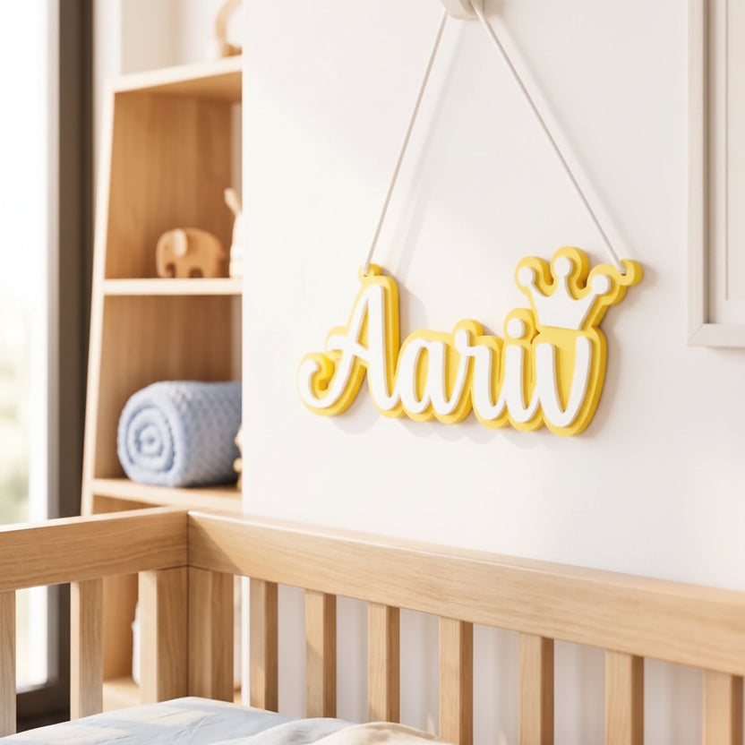 Yellow decorative sign with 'Aariiv' hanging above a crib in a nursery.