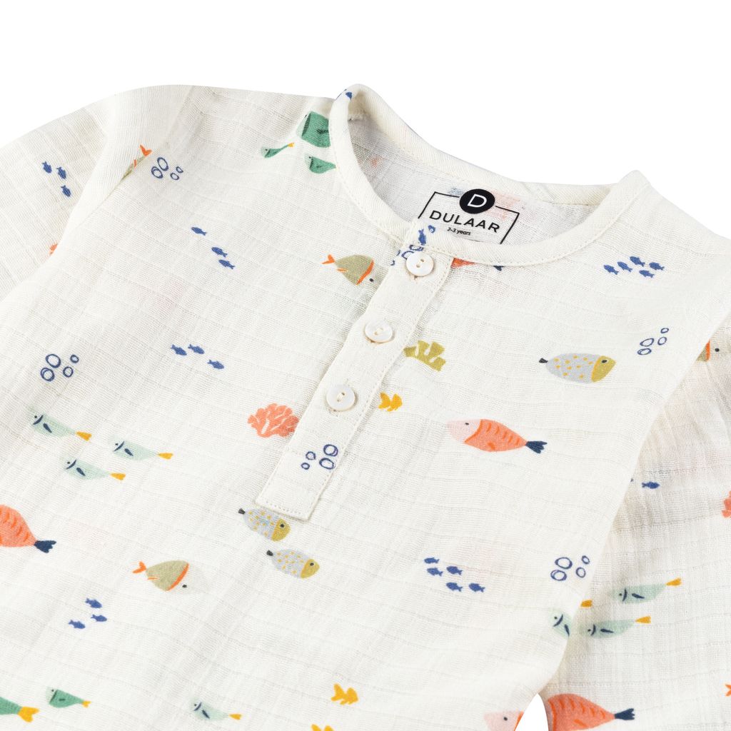 Baby romper with fish pattern and Dulaar branding on a white background