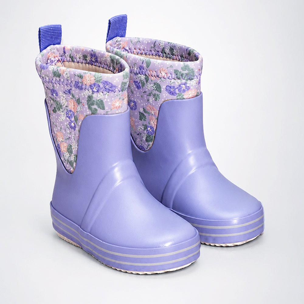 Pair of purple rubber boots with floral patterned cuffs on a white background