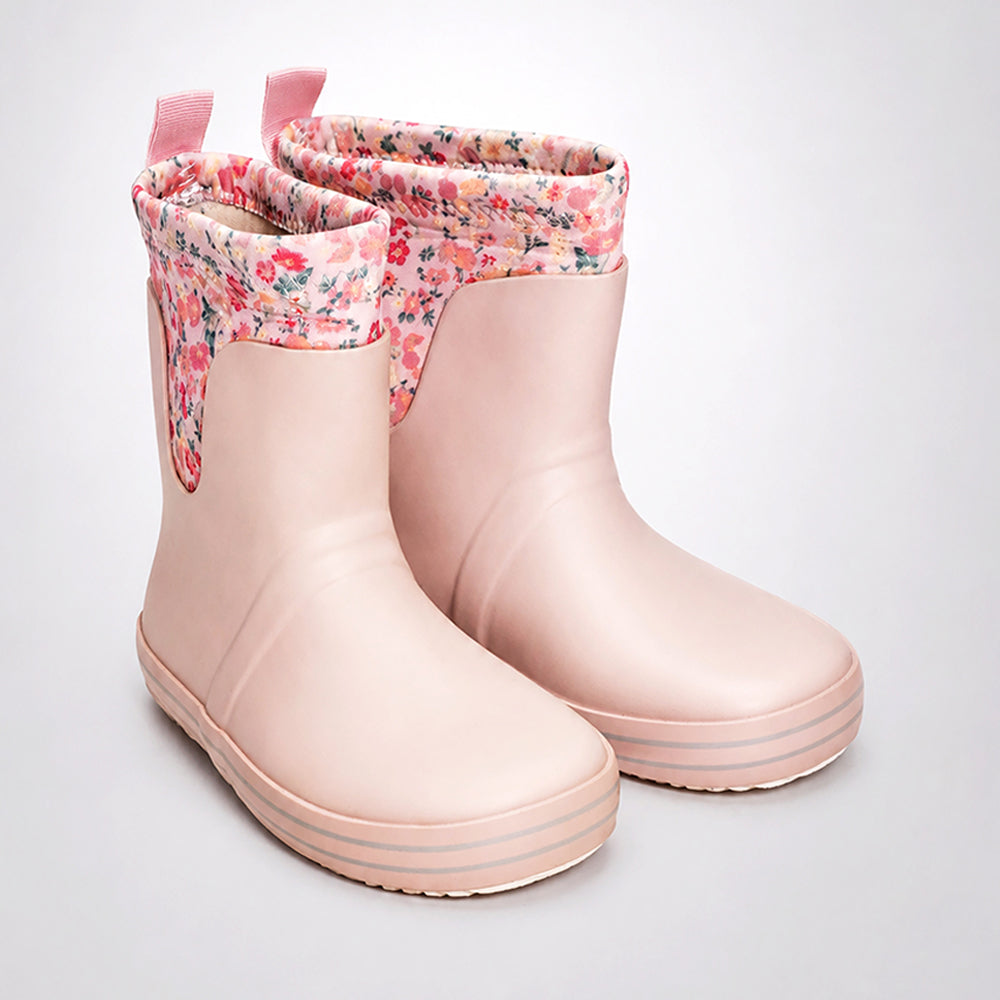 Pair of pink rain boots with floral lining on a light gray background