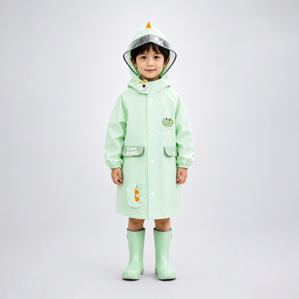 Child wearing a green raincoat with cartoon character design on a white background