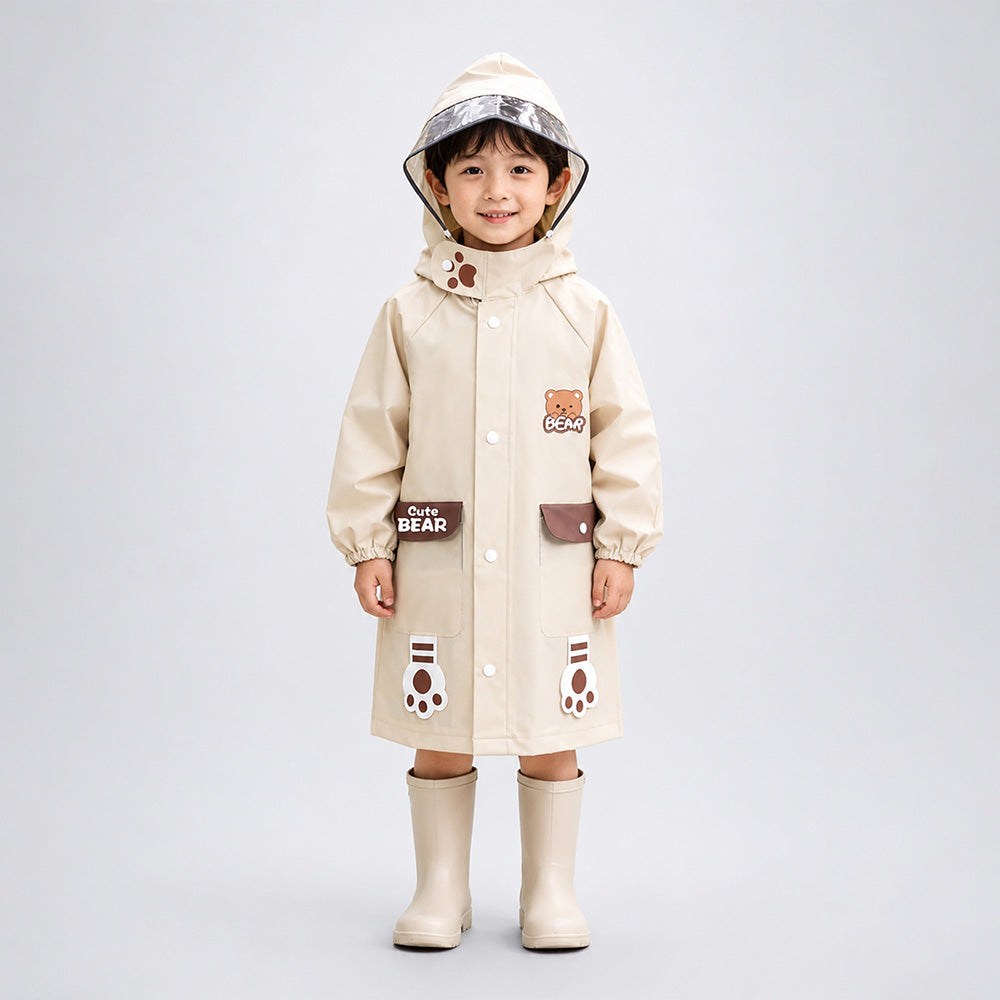 Child wearing a beige raincoat with bear designs on a light gray background