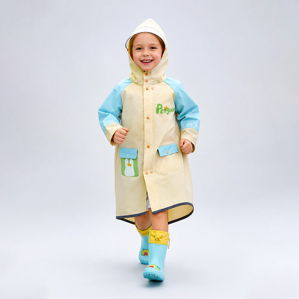 Child wearing a beige raincoat with blue accents and a hood, standing on a light gray background.