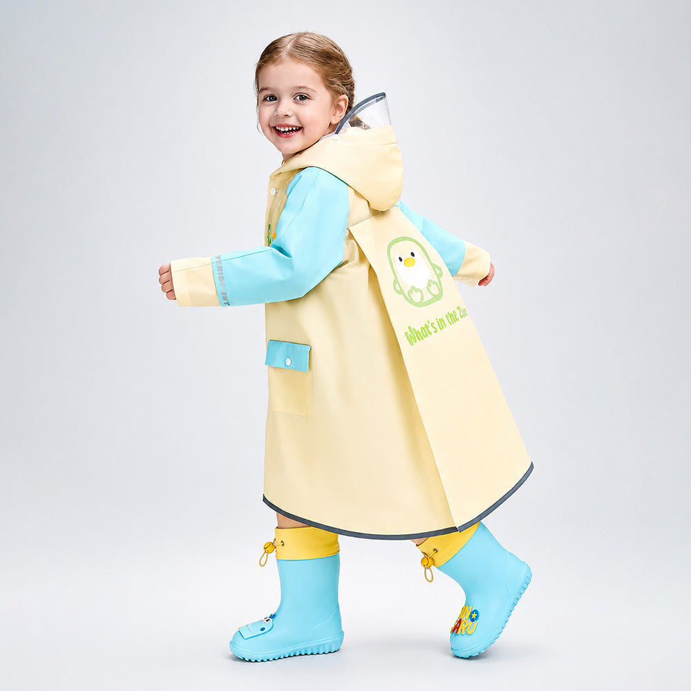 Child wearing a yellow raincoat with a cartoon character on a gray background