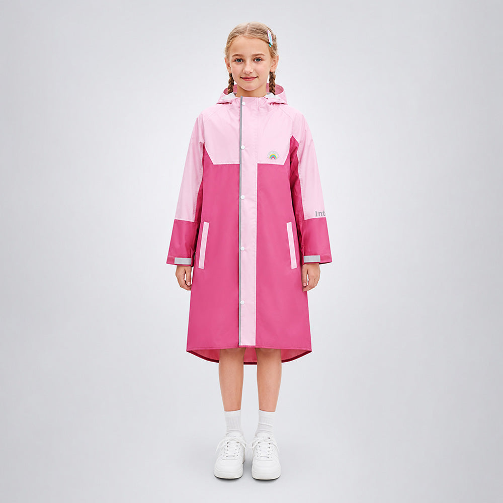 Girl wearing a pink and white raincoat on a light gray background