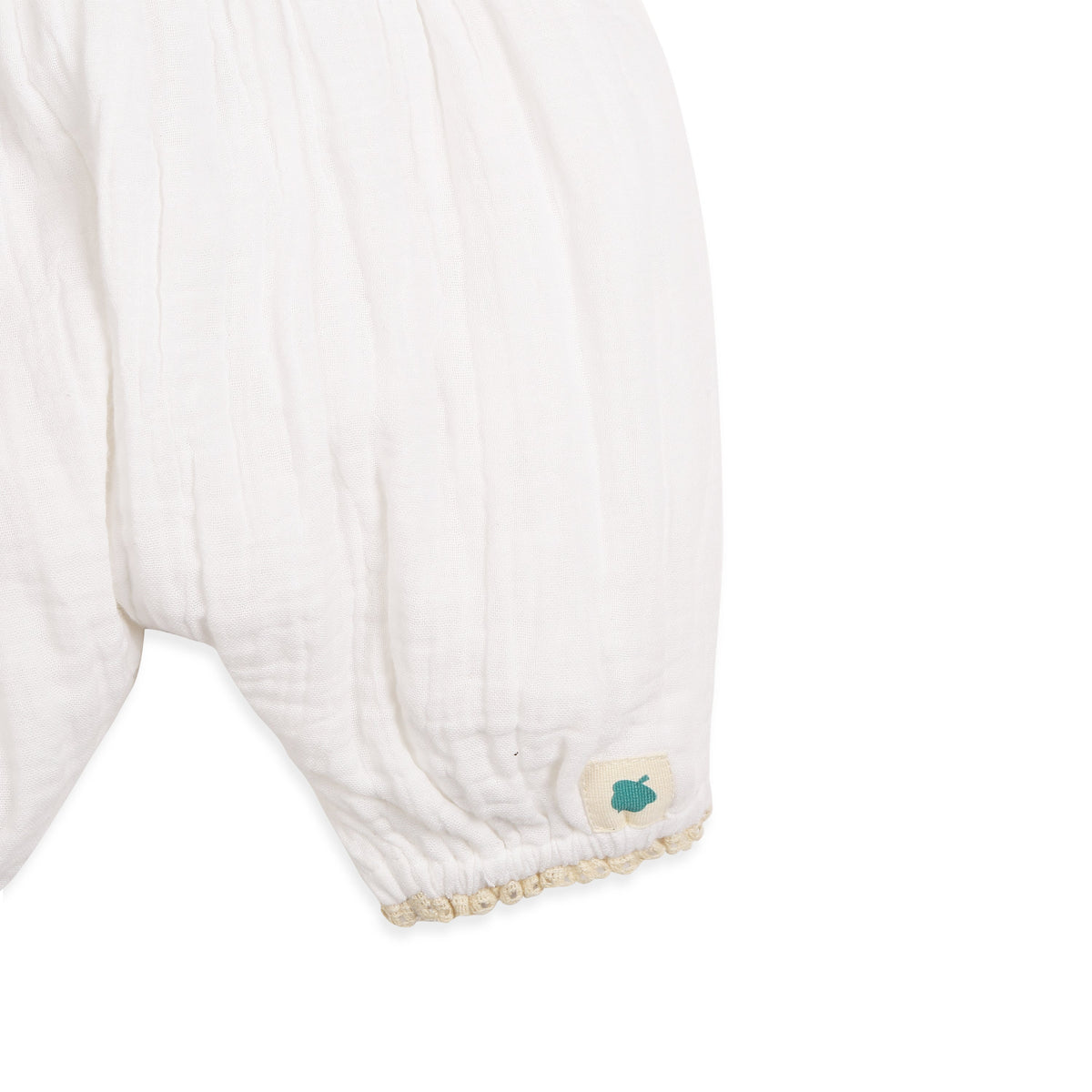 My Milestones Fawn Crochet Yoke Romper in Double Cloth with Ruffle Details - White