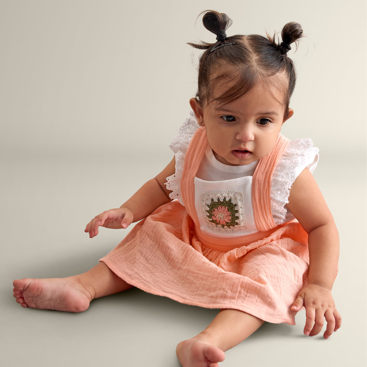 My Milestones Peony Handcrafted Crochet Detail Dungaree Dress in Double Cloth with Bio-Wash Ruffle Detail Tee - Peach