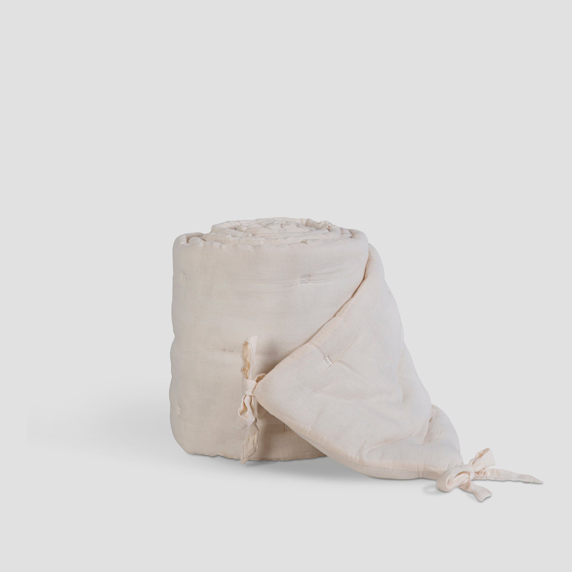 Beige fabric roll on a white background