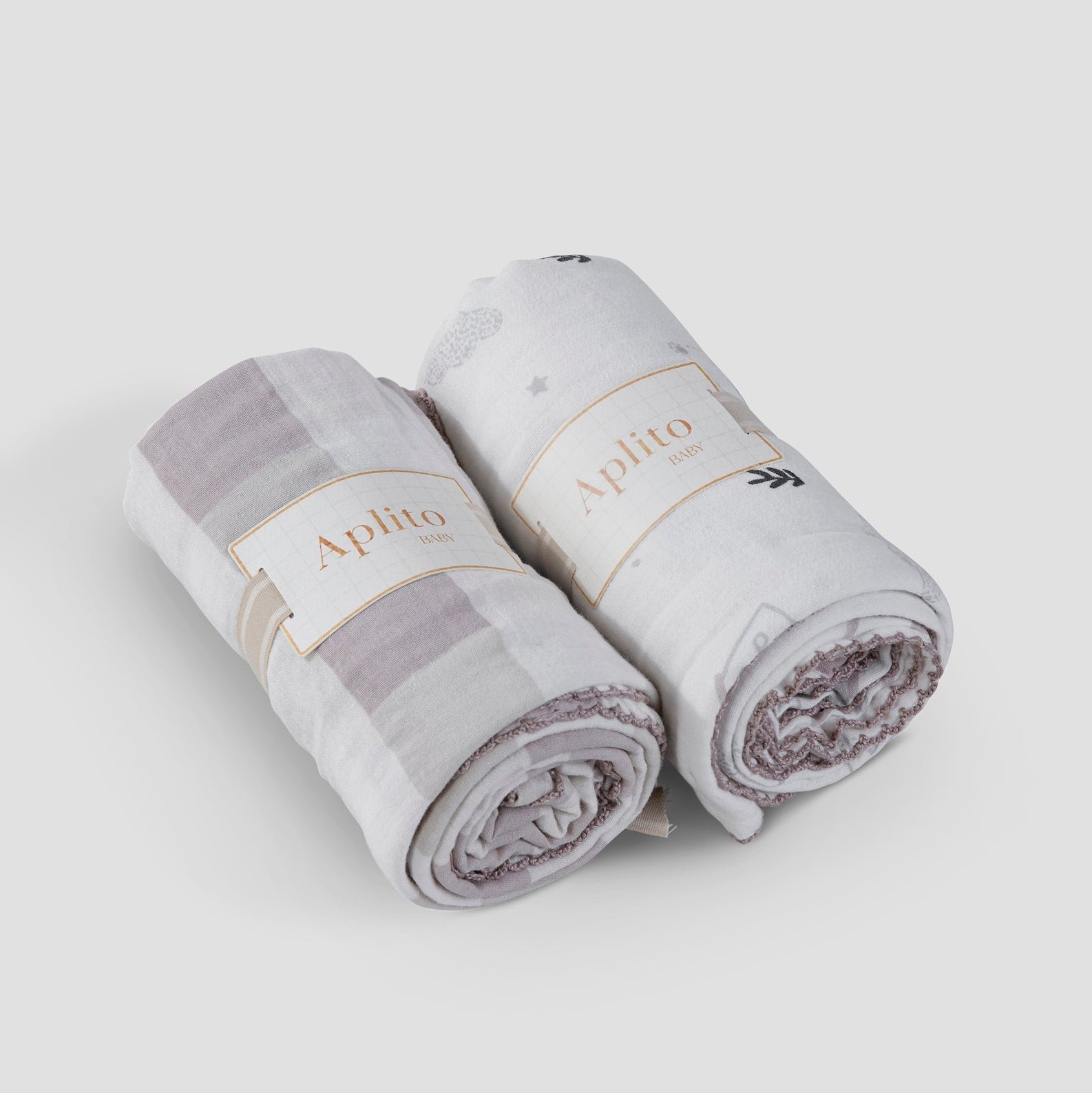 Two rolled-up towels with 'Aphito' branding on a light gray background