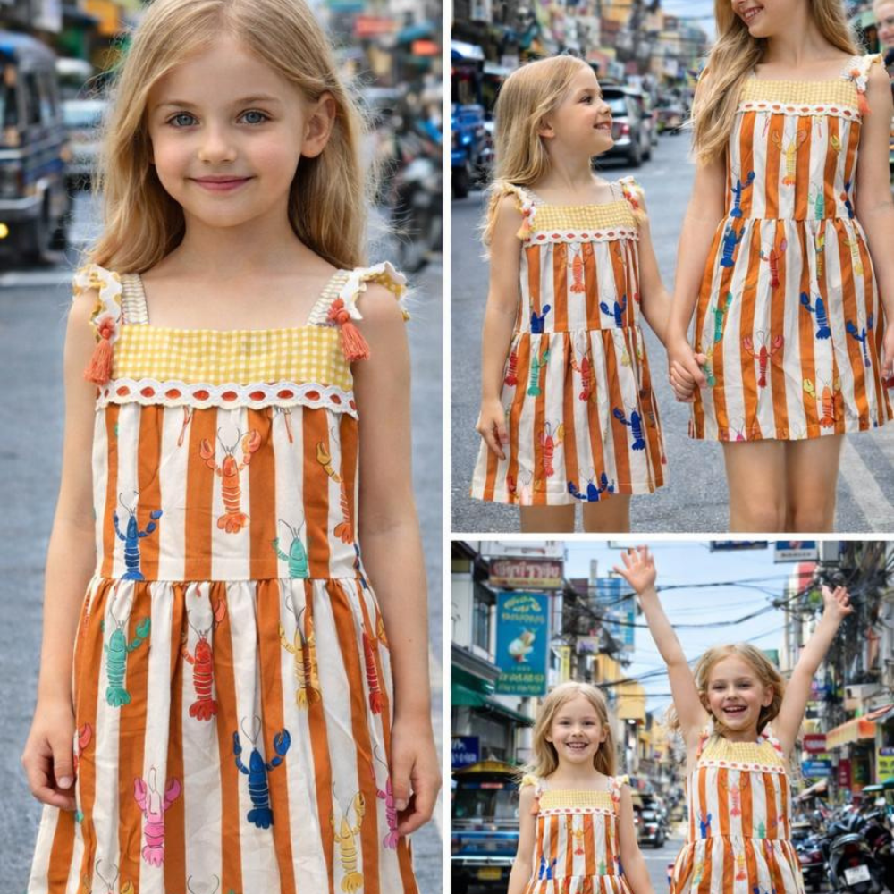 Lobster colourful print sleeveless dress. Detailed with lace trims on shoulder straps