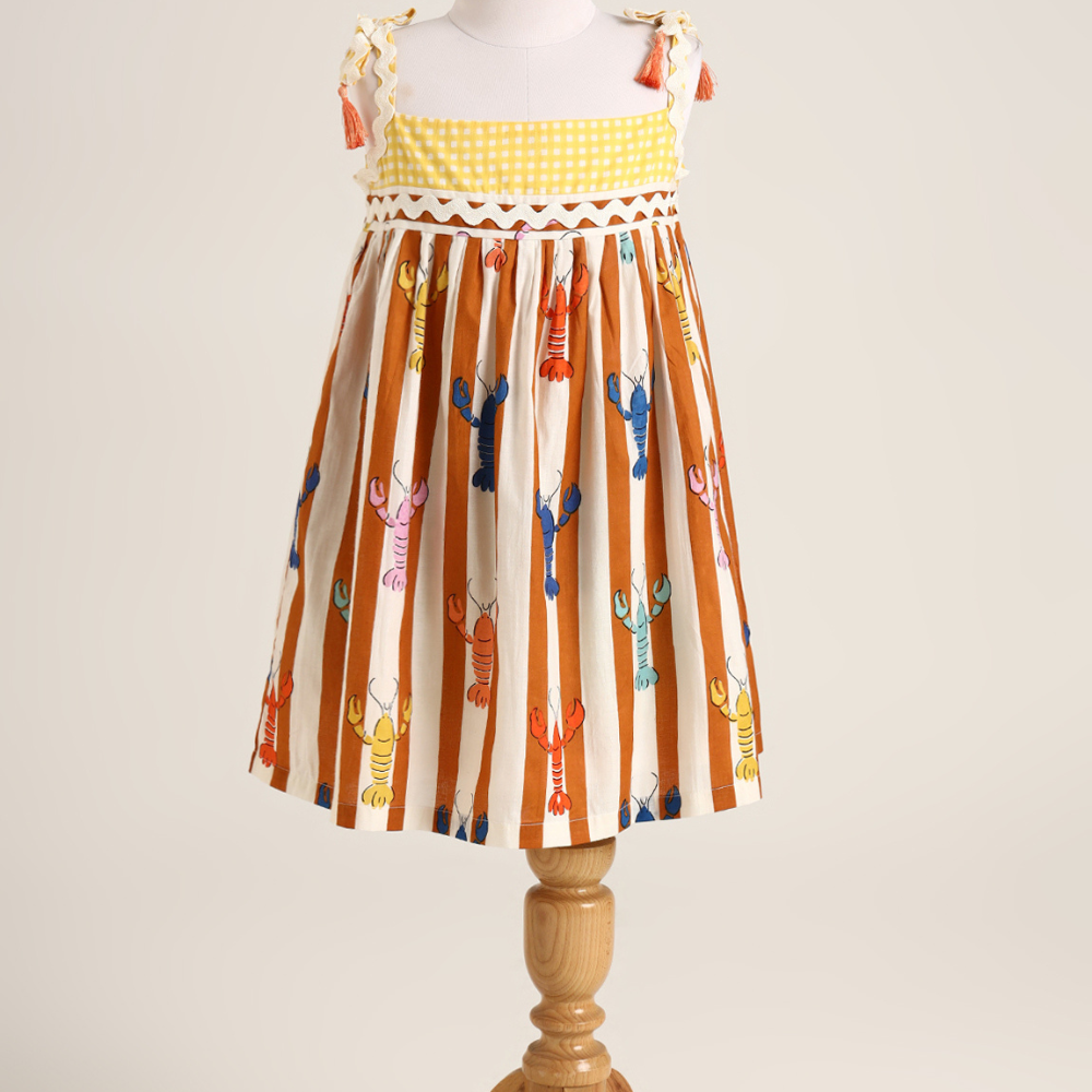 Lobster colourful print sleeveless dress. Detailed with lace trims on shoulder straps