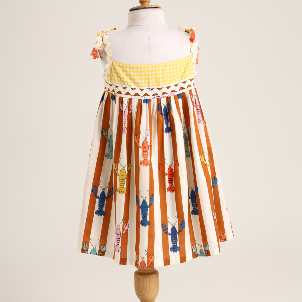 Lobster colourful print sleeveless dress. Detailed with lace trims on shoulder straps