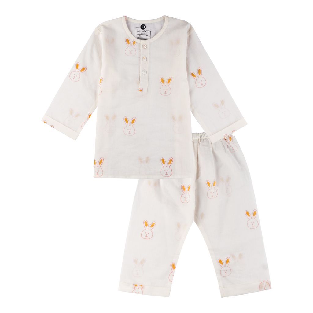 Baby pajama set with bunny patterns on a white background