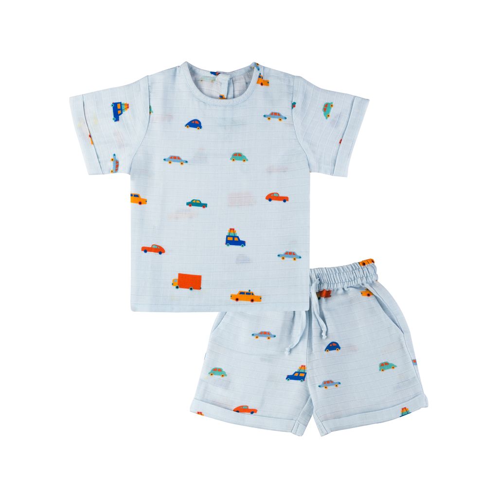 Children's outfit with t-shirt and shorts featuring vehicle patterns on a white background