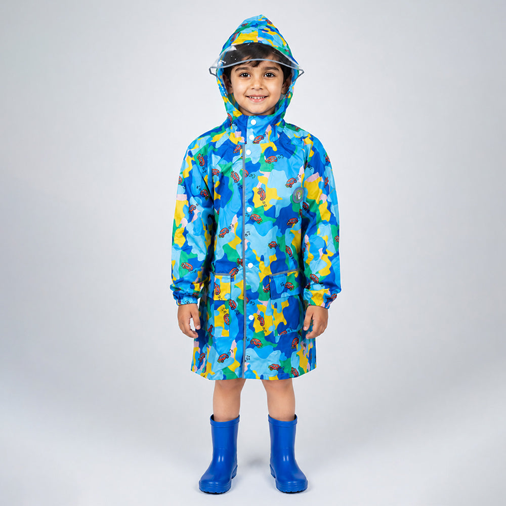 Child wearing blue color pop knee-length raincoat with hood, clear brim and blue rain boots