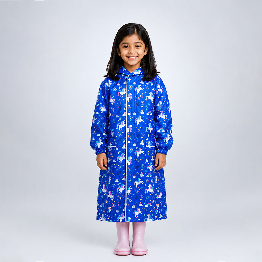 Child wearing navy unicorn print knee-length raincoat with hood and pink rain boots