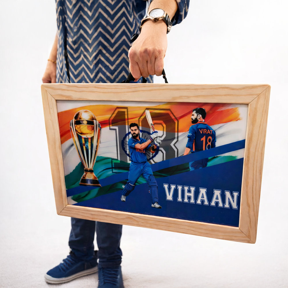 Personalised foldable wooden desk with cricket-themed Virat design, trophy artwork, and the name “VIHAAN,” shown being carried by the handle.
