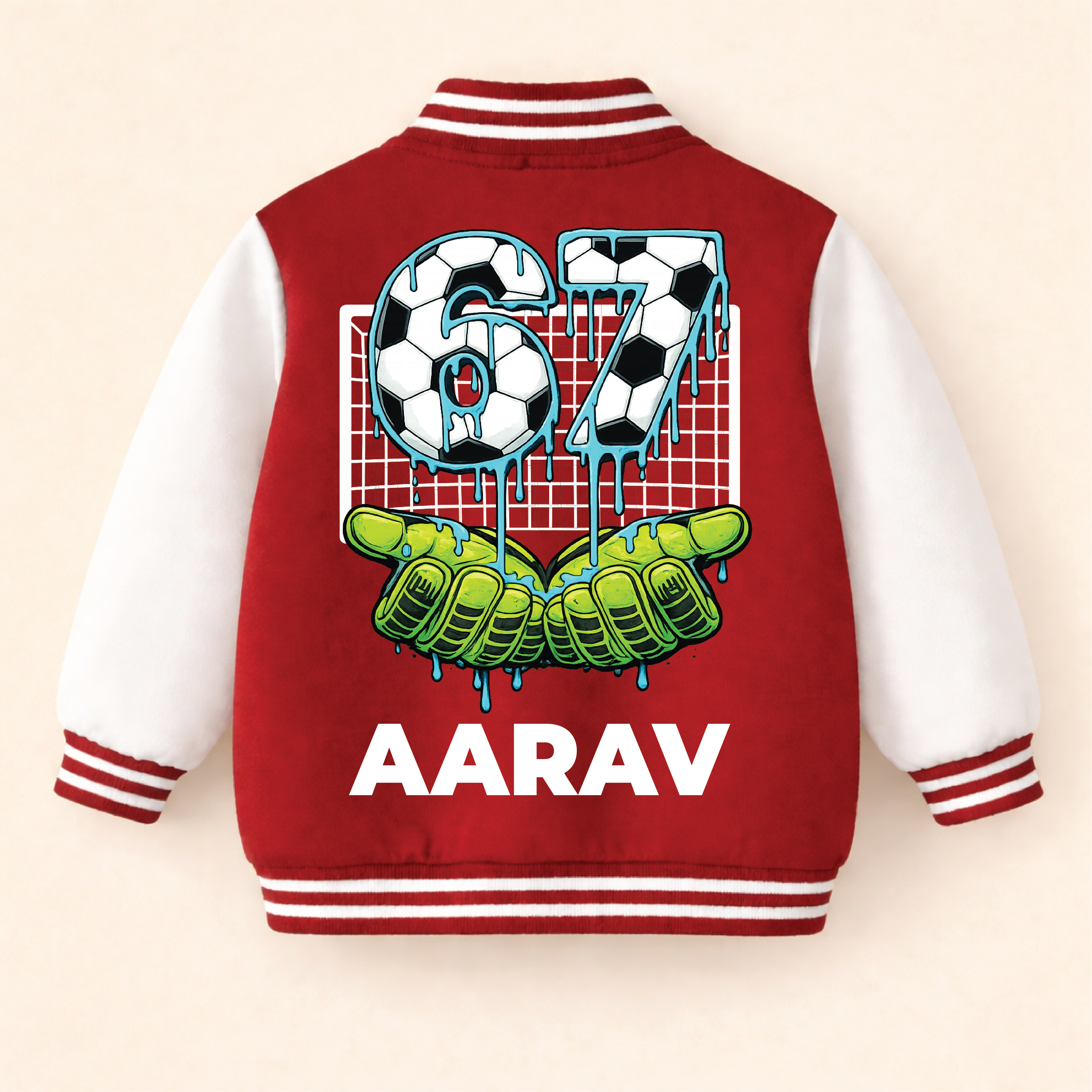 Red and white personalised kids varsity jacket with soccer-themed design and the name “AARAV” on a beige background.