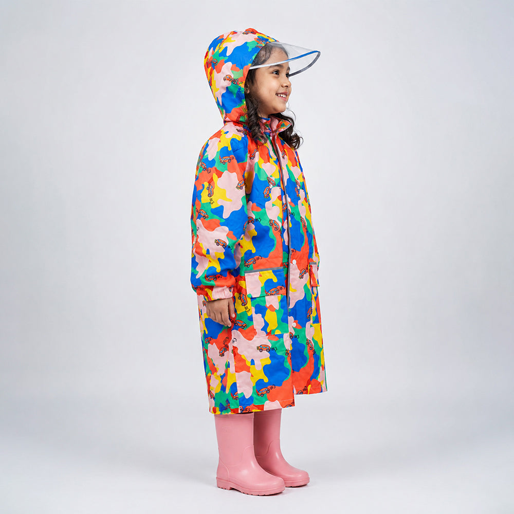 Side view of pink color pop knee-length kids raincoat with hood and transparent brim