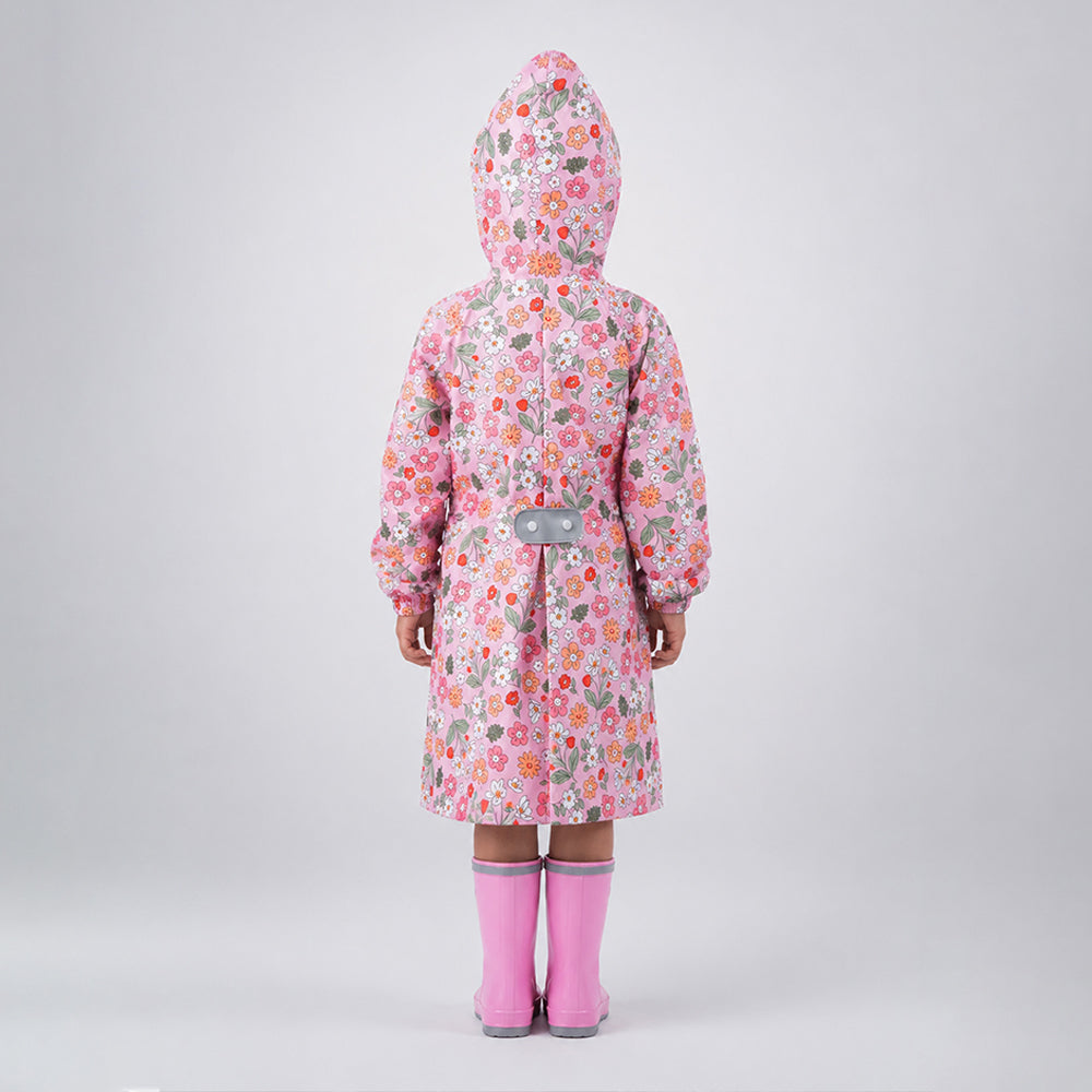 Back view of pink floral garden print kids raincoat with hood and expandable backpack panel