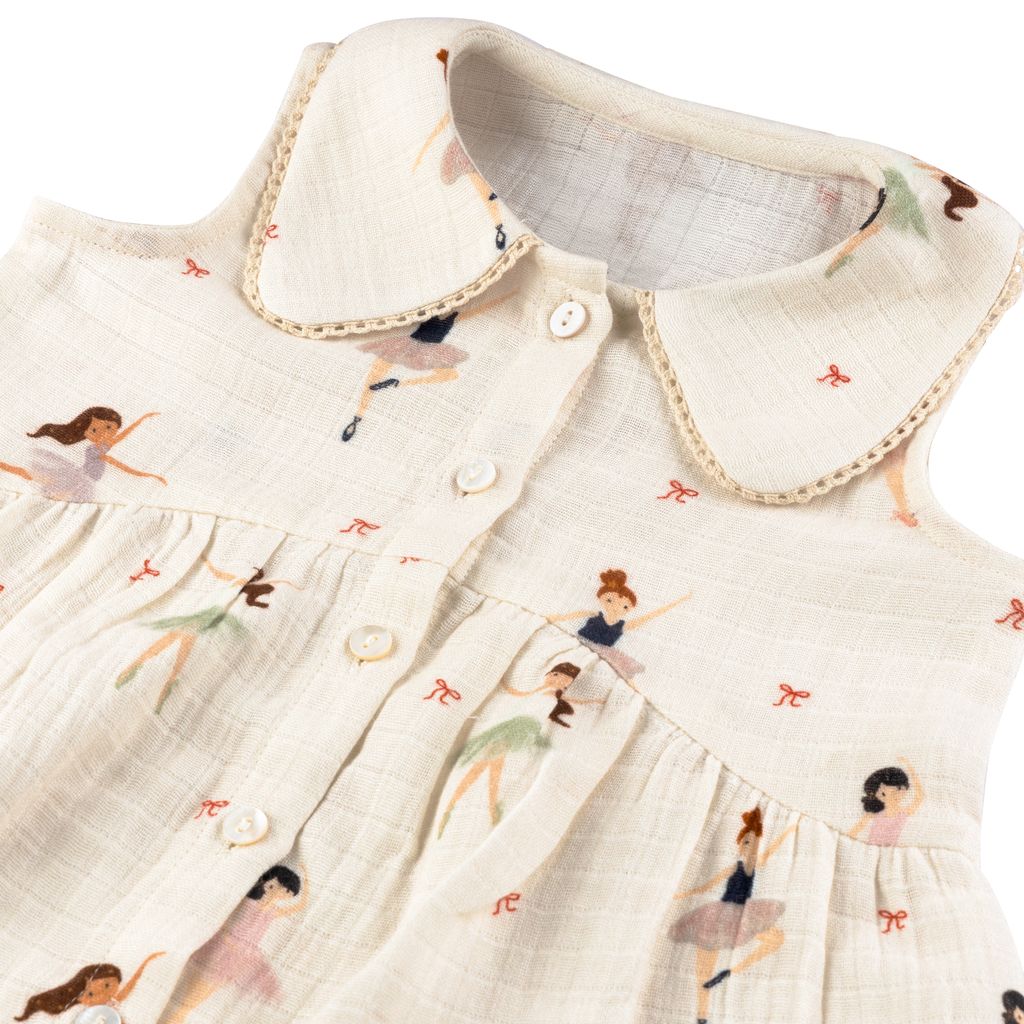 Children's dress with printed design of girls dancing on a white background