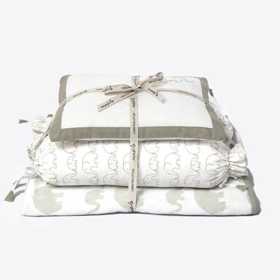New Baby Mini Cot Set in Elephant Parade print with bamboo muslin newborn blanket, pillow and bolsters